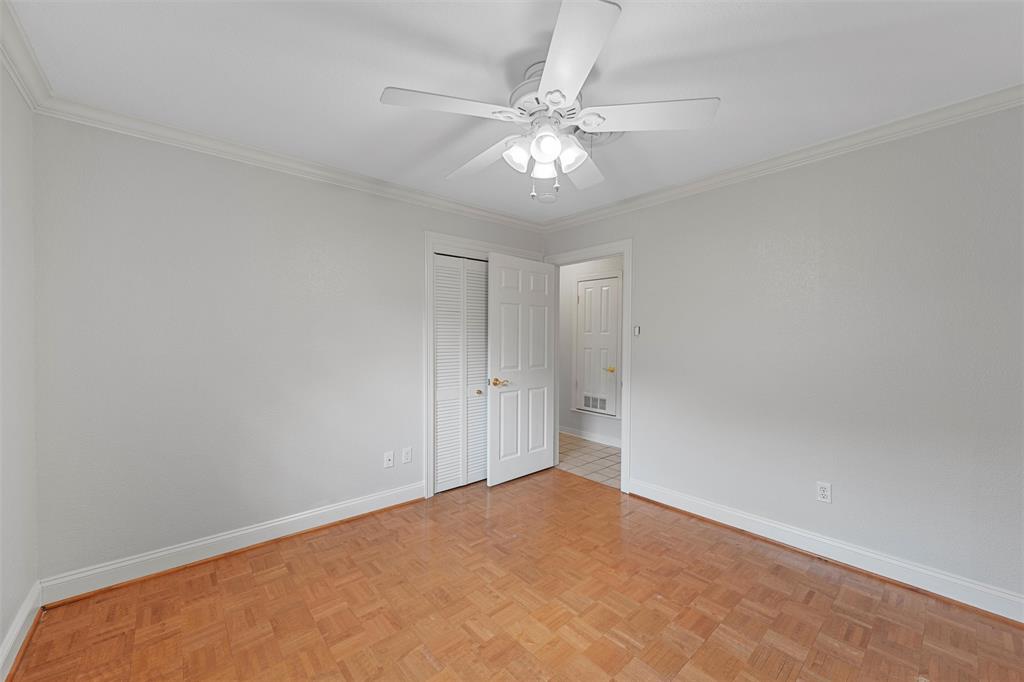 2131 Mountainview Drive Waco, TX 76710 - Photo 15 of 27 Unfurnished bedroom featuring ornamental molding, a ceiling fan, and a closet
