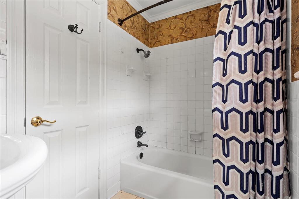 2131 Mountainview Drive Waco, TX 76710 - Photo 18 of 27 Bathroom with shower / tub combo with curtain and ornamental molding