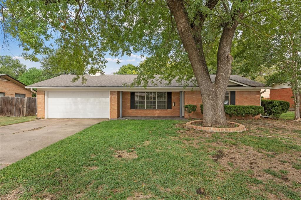 2131 Mountainview Drive Waco, TX 76710 - Photo 26 of 27 Ranch-style home with concrete driveway, brick siding, an attached garage, and a shingled roof