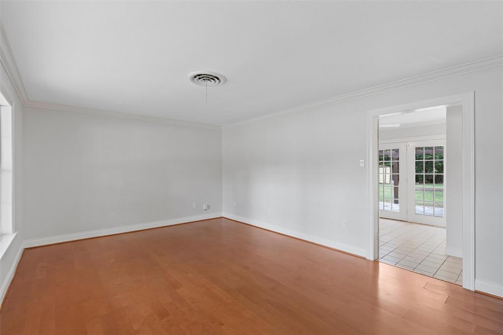 2131 Mountainview Drive Waco, TX 76710 - Photo 5 of 27 Spare room with light wood-style floors, ornamental molding, and french doors