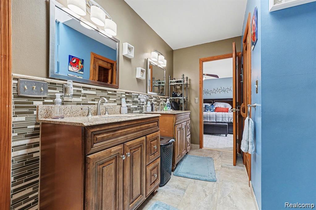 7277 Cardinal Road Algonac, MI 48001 - Photo 28 of 36 Ensuite bathroom featuring vanity and baseboards