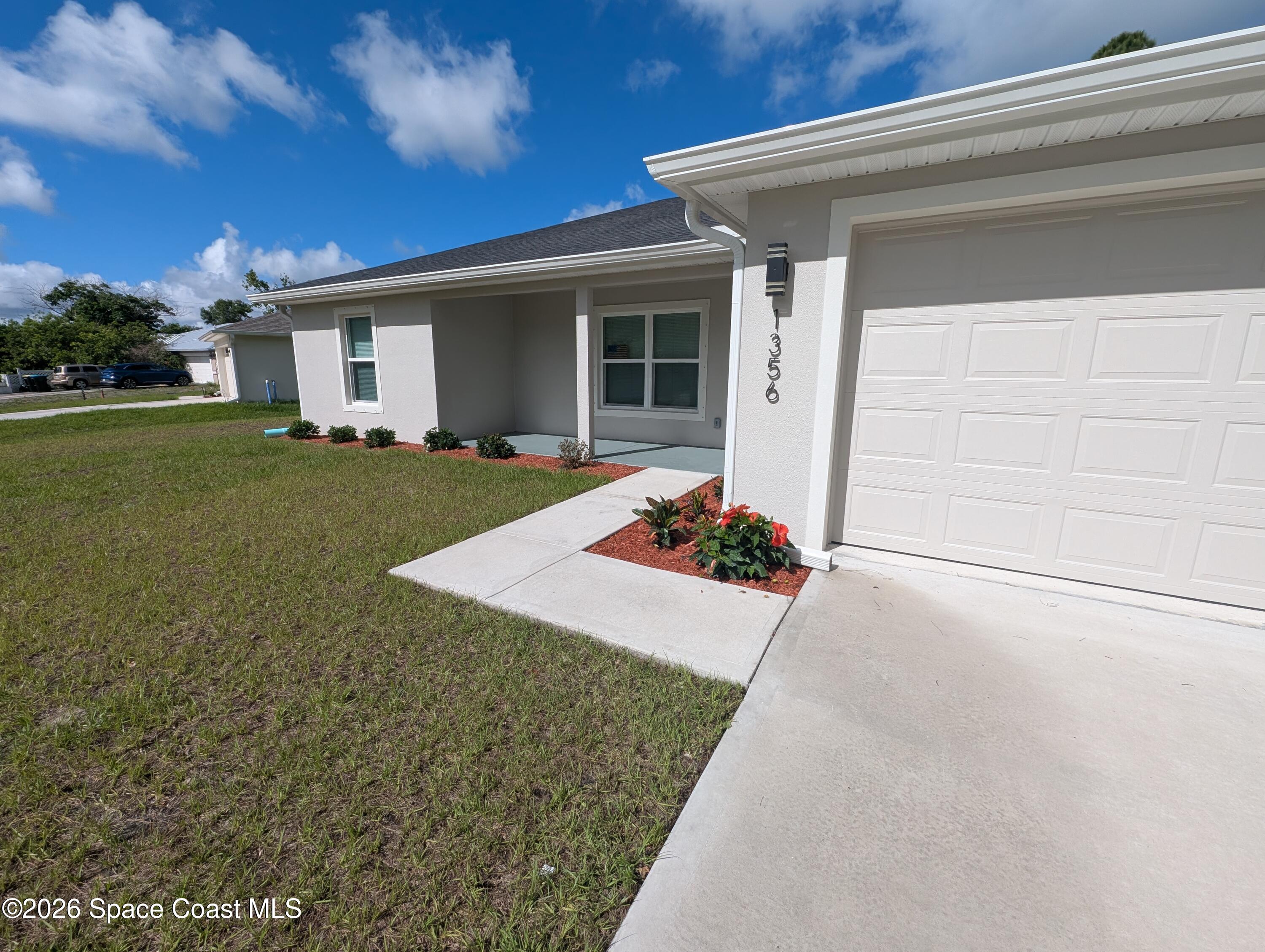 1356 Torgerson Road Southeast Palm Bay, FL 32909 - Photo 34 of 46 front walk 2