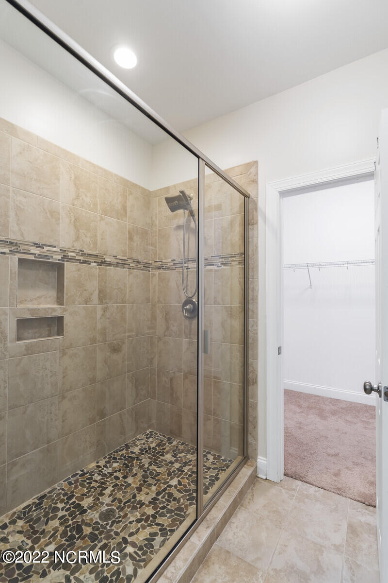 517 Winding Creek Road Rocky Point, NC 28457 - Photo 29 of 49 Master shower has pebble flooring