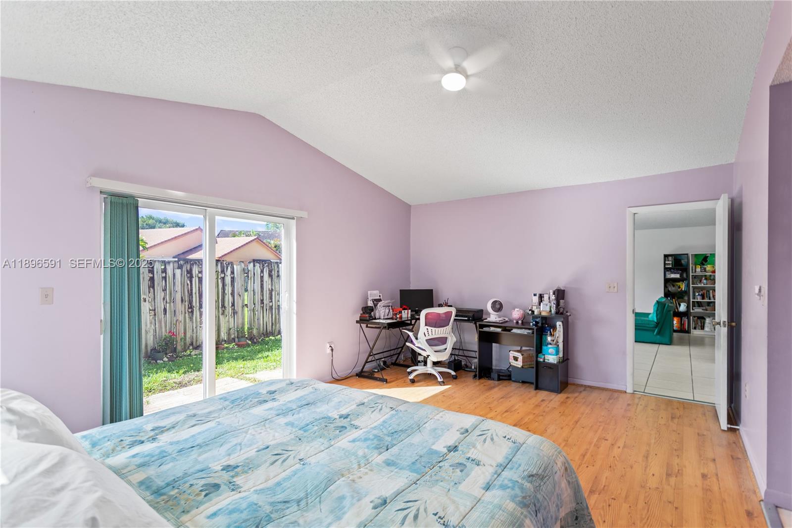 6090 Northwest 179th Terrace Hialeah, FL 33015 - Photo 15 of 29 a bed room with a bed and a chair