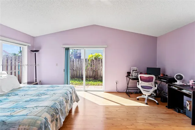 a bedroom with a bed and a mirror