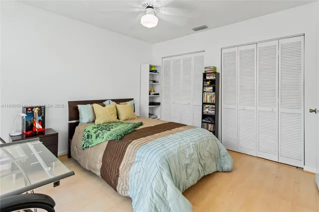 a bedroom with a bed and a closet