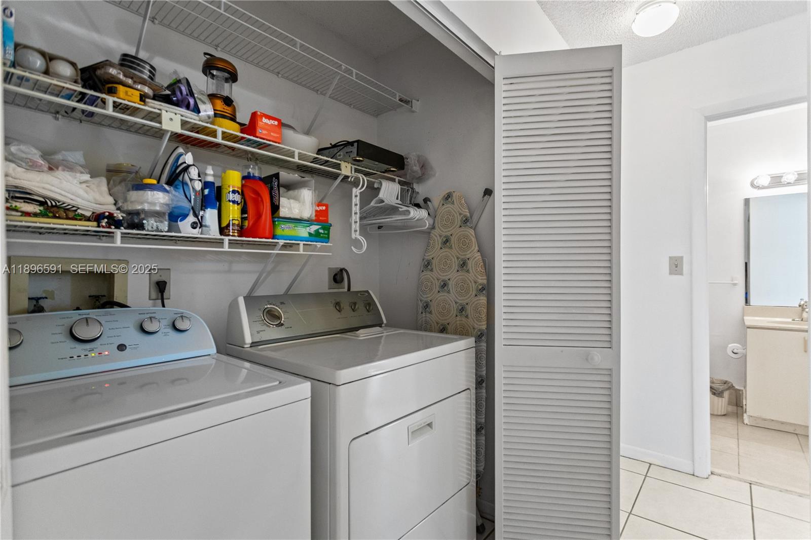 6090 Northwest 179th Terrace Hialeah, FL 33015 - Photo 22 of 29 a utility room with dryer and washer