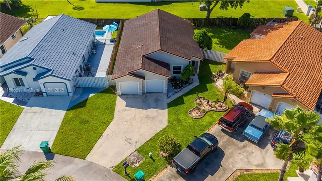 an aerial view of a house with a garden