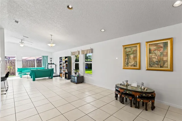 a view of a livingroom with furniture and window