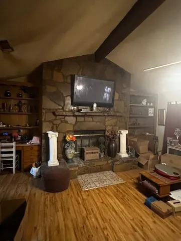 a room with lots of appliances and a view of living room
