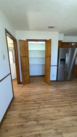 a view of empty room with a fireplace