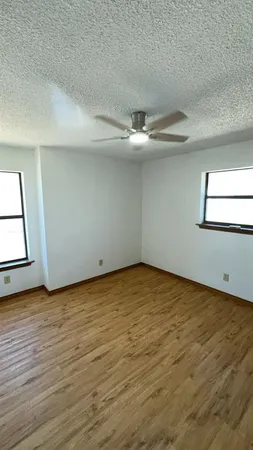 a view of an empty room with a fireplace