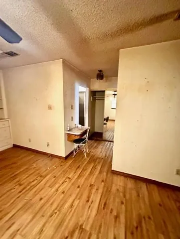 a view of a living room with a wooden floor