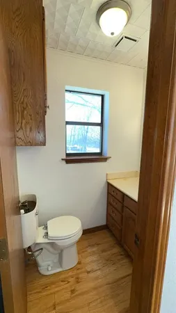 a view of room with window and wooden floor