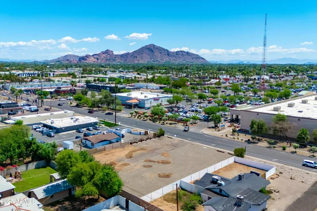 an aerial view of residential houses with outdoor space
