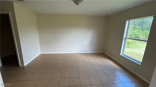 a view of an empty room and window