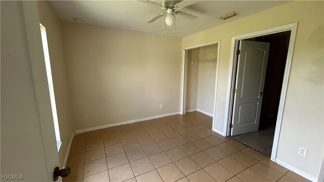 an empty room and closet area