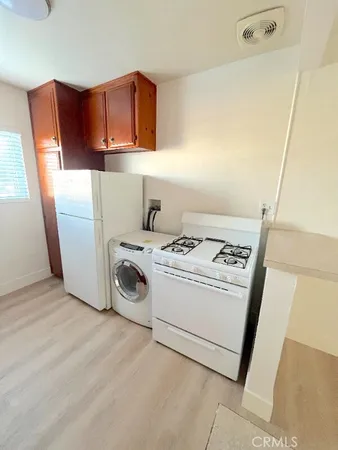 a kitchen with stainless steel appliances granite countertop wooden cabinets a sink and dishwasher