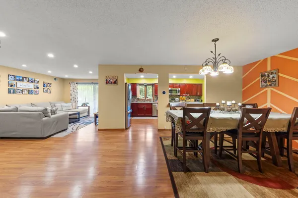 a view of a dining room with furniture and wooden floor