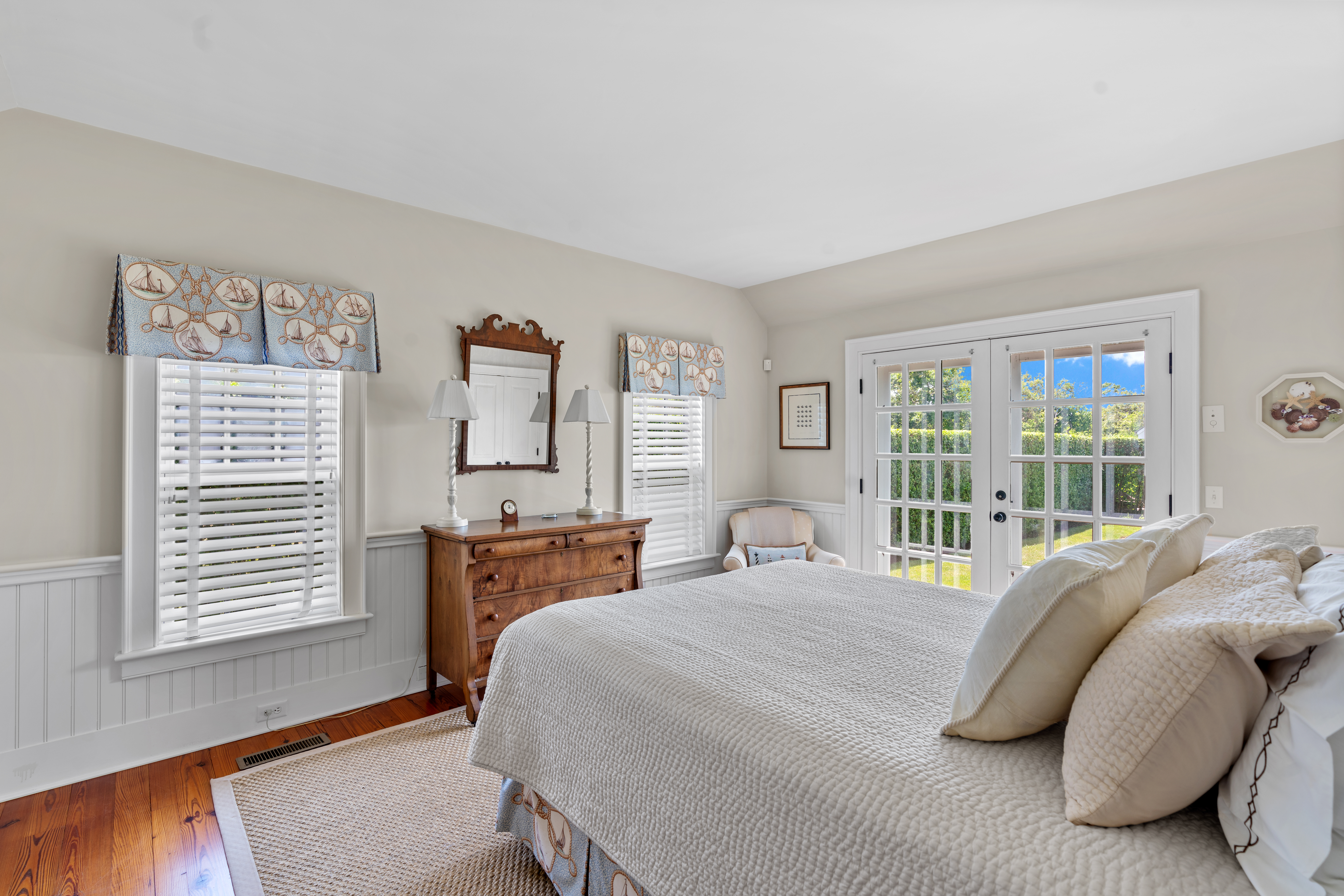 42 Main Street Nantucket, MA 02554 - Photo 17 of 40 a bedroom with a bed and wooden floor