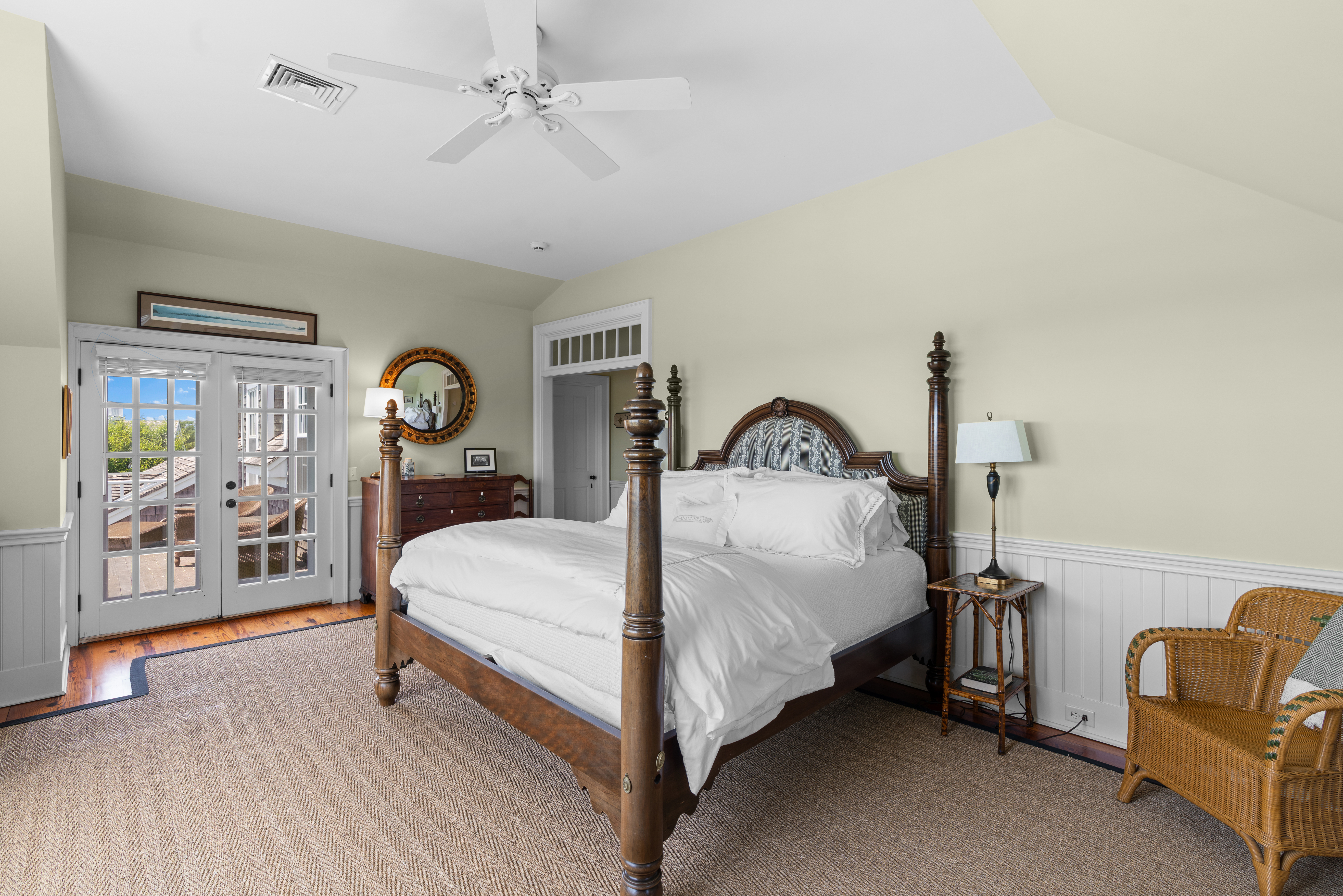 42 Main Street Nantucket, MA 02554 - Photo 20 of 40 a bed sitting in a spacious bedroom next to a window and a lamp