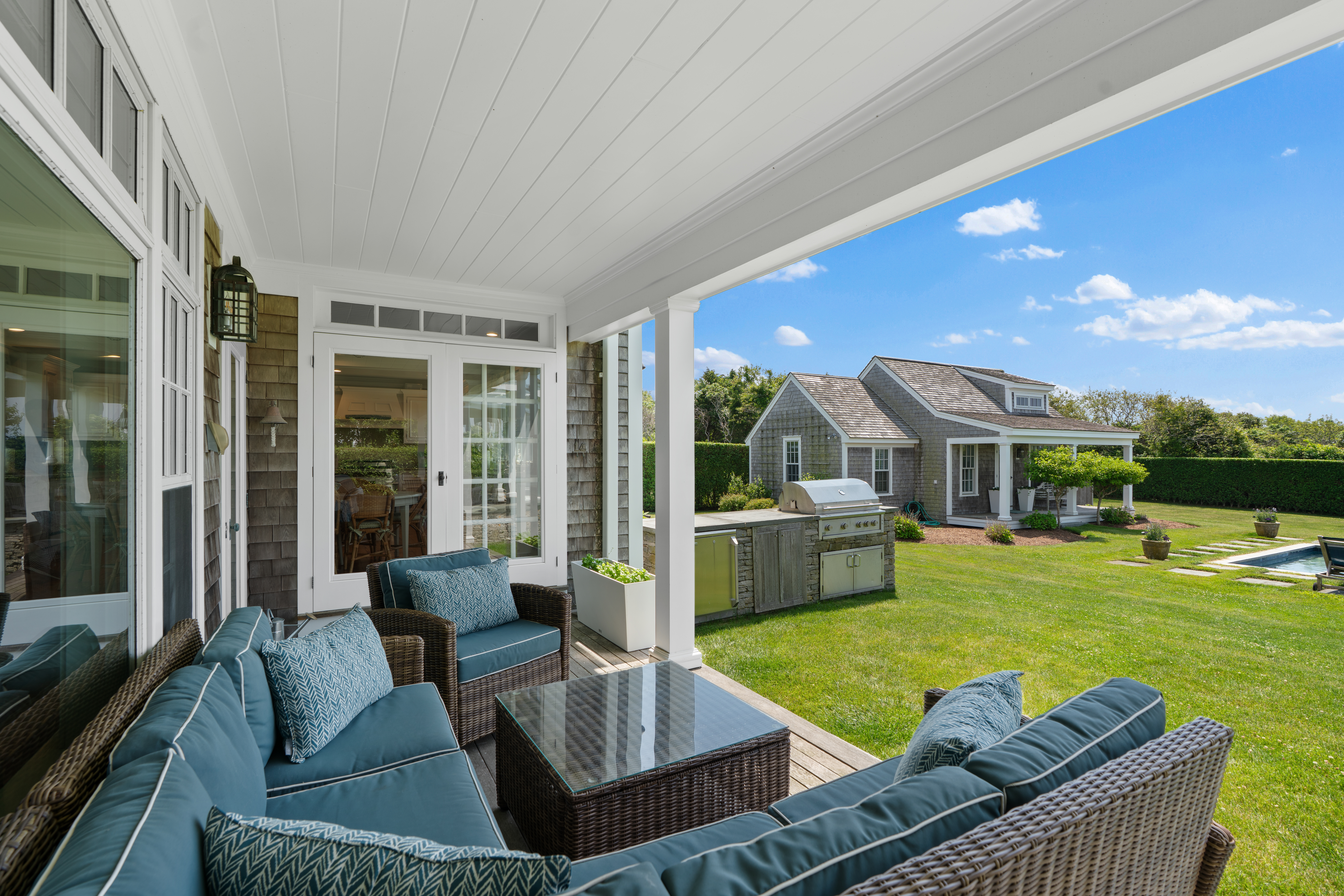 42 Main Street Nantucket, MA 02554 - Photo 28 of 40 a view of a patio with couches chairs and a table and chairs