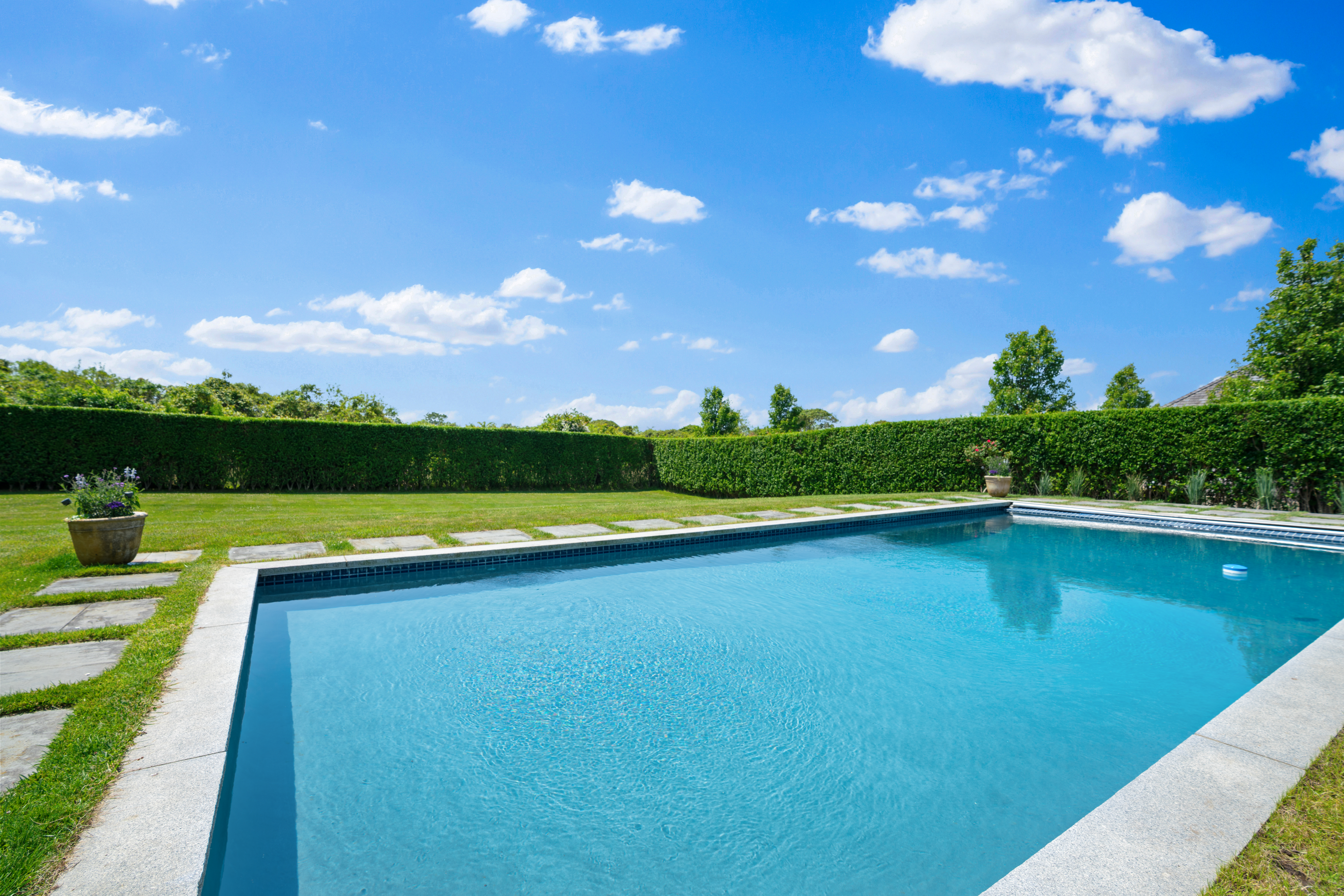 42 Main Street Nantucket, MA 02554 - Photo 3 of 40 a view of a swimming pool is middle in the garden