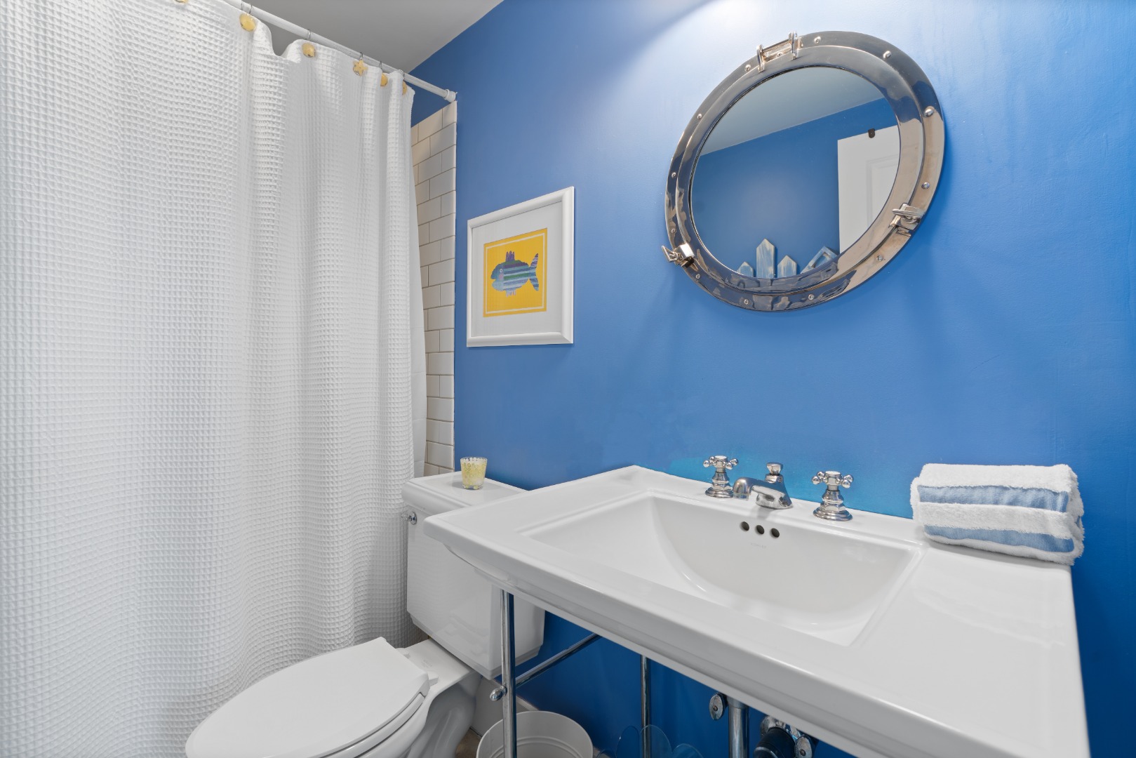 42 Main Street Nantucket, MA 02554 - Photo 36 of 40 a bathroom with a sink and a mirror