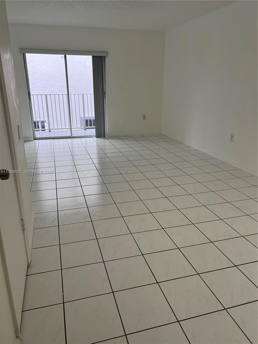 2750 West 76th Street, Unit 208 Hialeah, FL 33016 - Photo 4 of 10 a view of a livingroom and window
