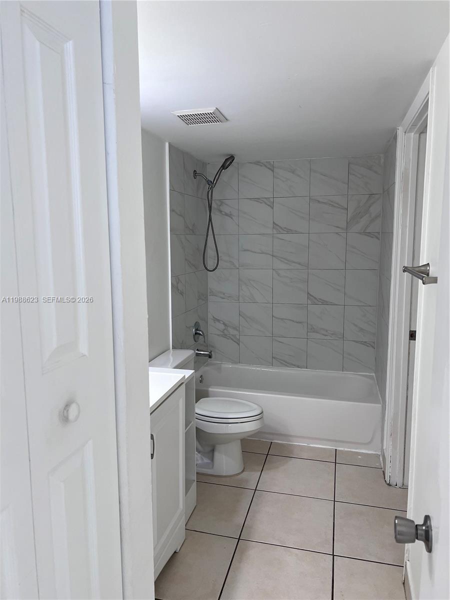 2750 West 76th Street, Unit 208 Hialeah, FL 33016 - Photo 8 of 10 a bathroom with a toilet and shower