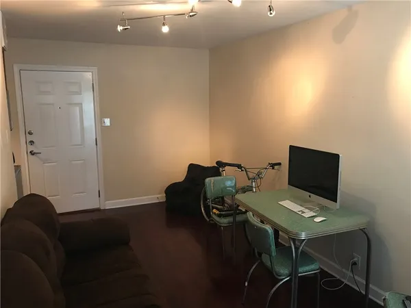 a laptop computer sitting on top of a desk