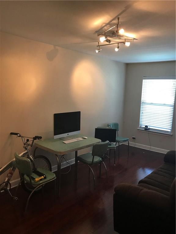 2020 South Congress Avenue, Unit 1313 Austin, TX 78704 - Photo 8 of 11 a view of a workspace with furniture and chandelier