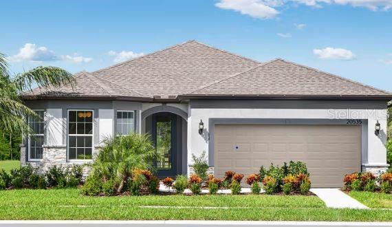 5765 Southwest 90th Court Road Ocala, FL 34481 - Photo 1 of 1 a front view of a house with a garden
