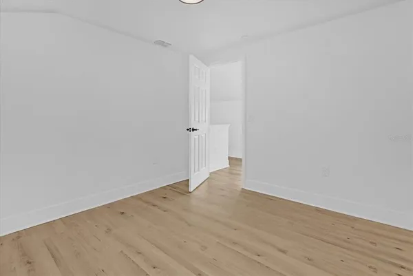 a bathroom with a shower a toilet and sink