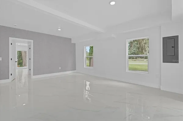 a view of an empty room with a window