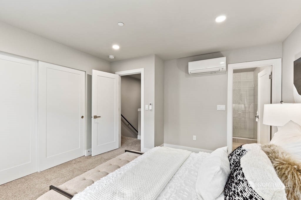 825 238th Place Southeast, Unit B8 Bothell, WA 98021 - Photo 20 of 32 a bedroom with a bed and a toilet