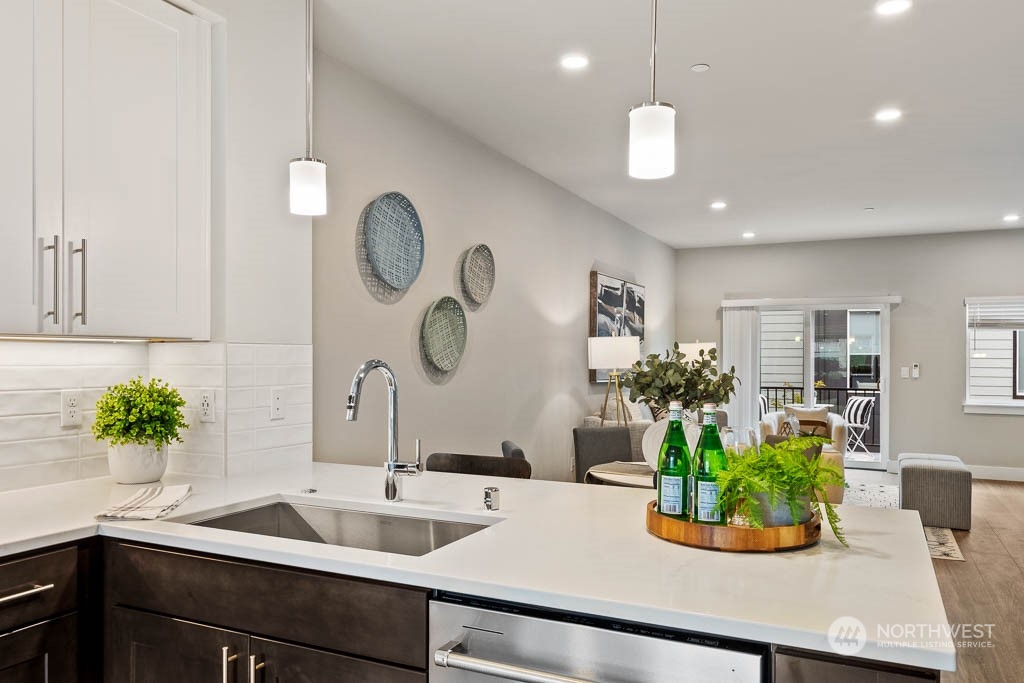 825 238th Place Southeast, Unit B8 Bothell, WA 98021 - Photo 9 of 32 a kitchen with a sink and a potted plant