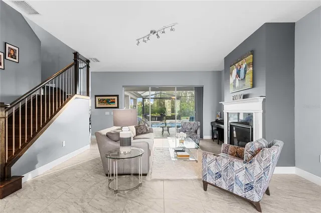 a bedroom with a bed and a ceiling fan