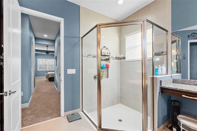 a kitchen with stainless steel appliances white cabinets and a granite counter tops