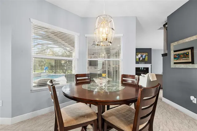 a bathroom with a granite countertop sink and a toilet