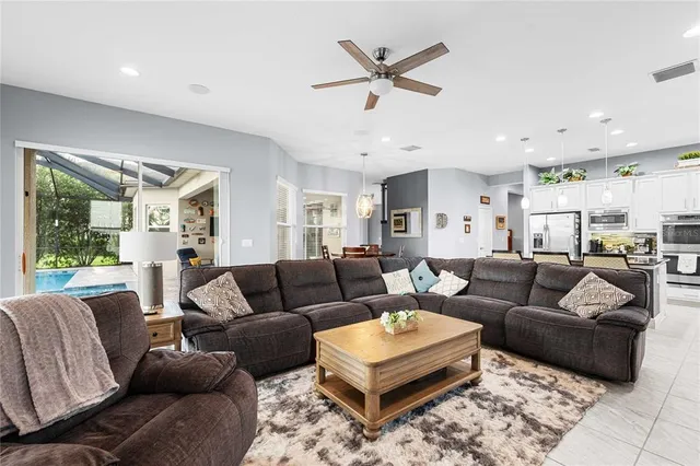 a bedroom with a bed a couch and a window