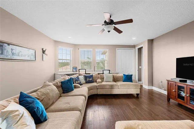 a view of a patio with a table and chairs under an umbrella