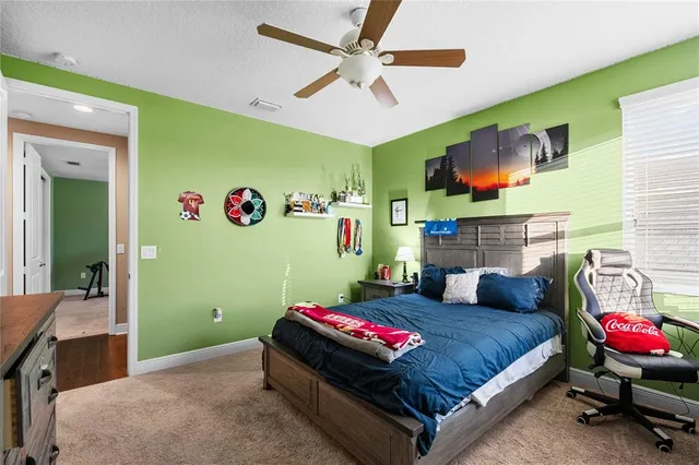 a kitchen with a stove a sink and a wooden cabinets