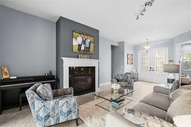 a living room with furniture and a fireplace