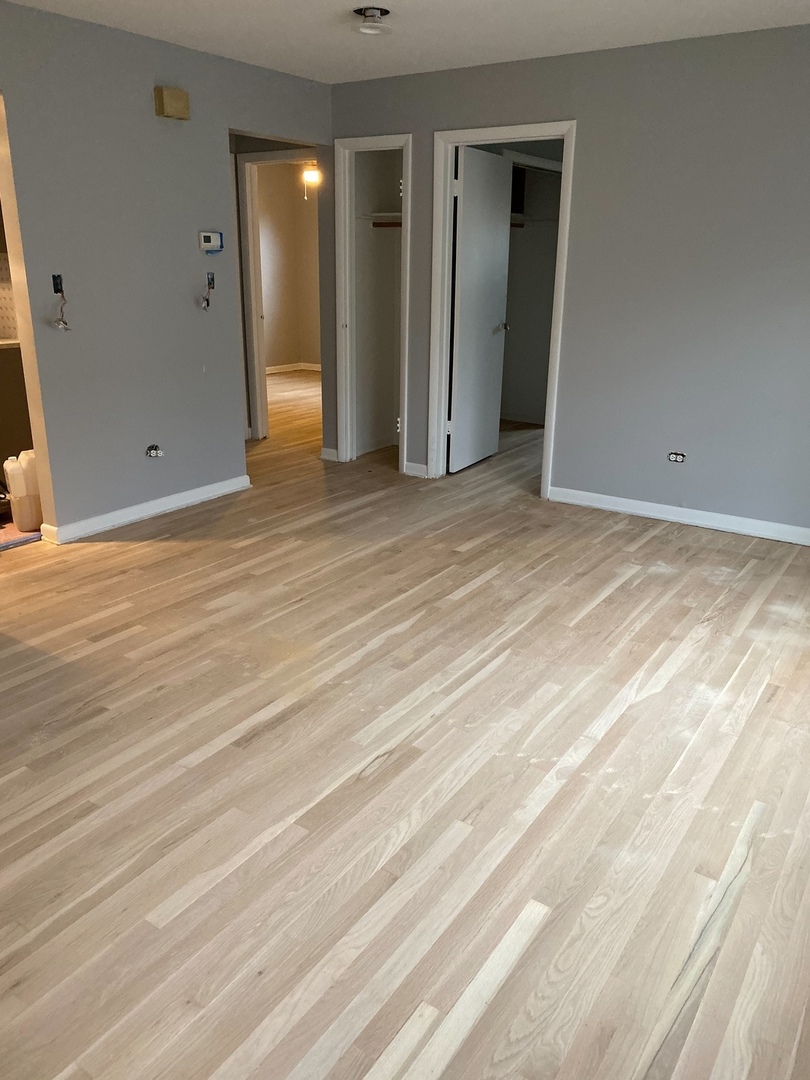 2290 182nd Place Lansing, IL 60438 - Photo 13 of 23 a view of an empty room with wooden floor