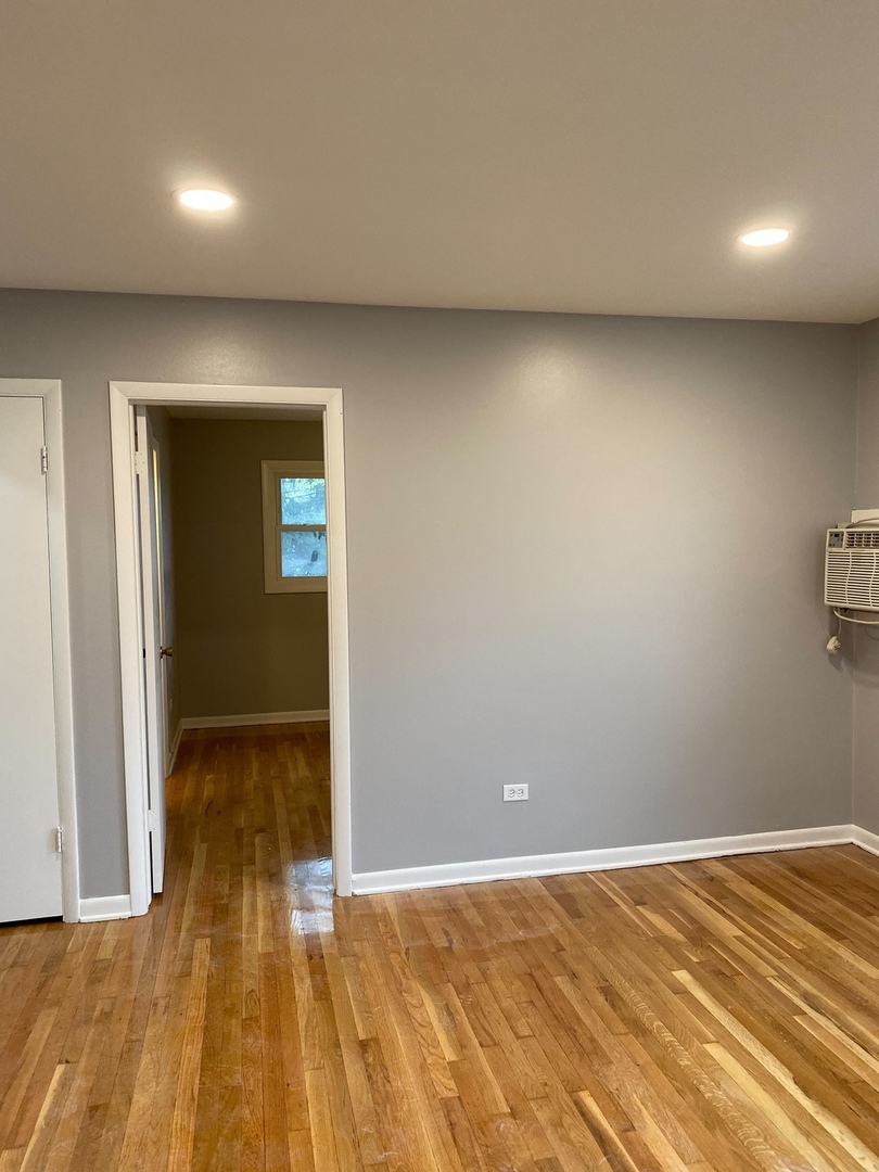 2290 182nd Place Lansing, IL 60438 - Photo 22 of 23 an empty room with wooden floor and closet