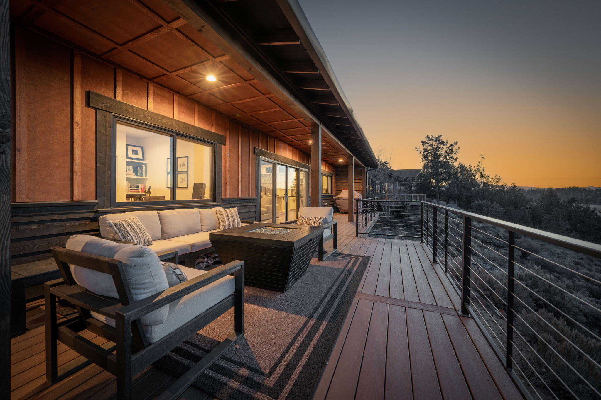 20350 Rock Canyon Road Bend, OR 97703 - Photo 4 of 47 a balcony with wooden floor and furniture