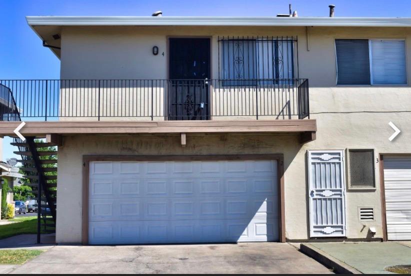 502 Caribrook Way, Unit 4 Stockton, CA 95207 - Photo 1 of 1 a front view of a house with balcony