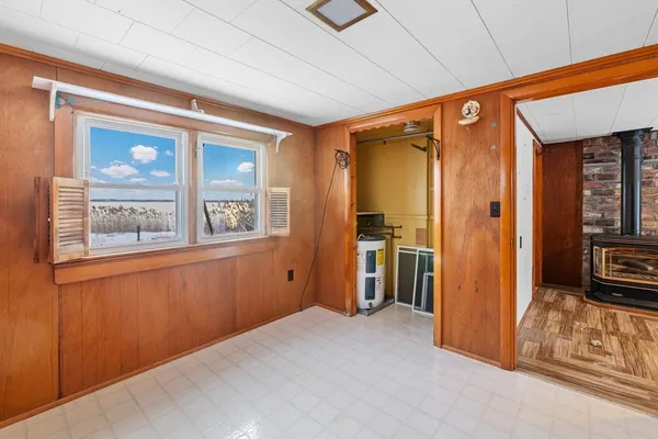 a view of a room with a flat tv screen and a window