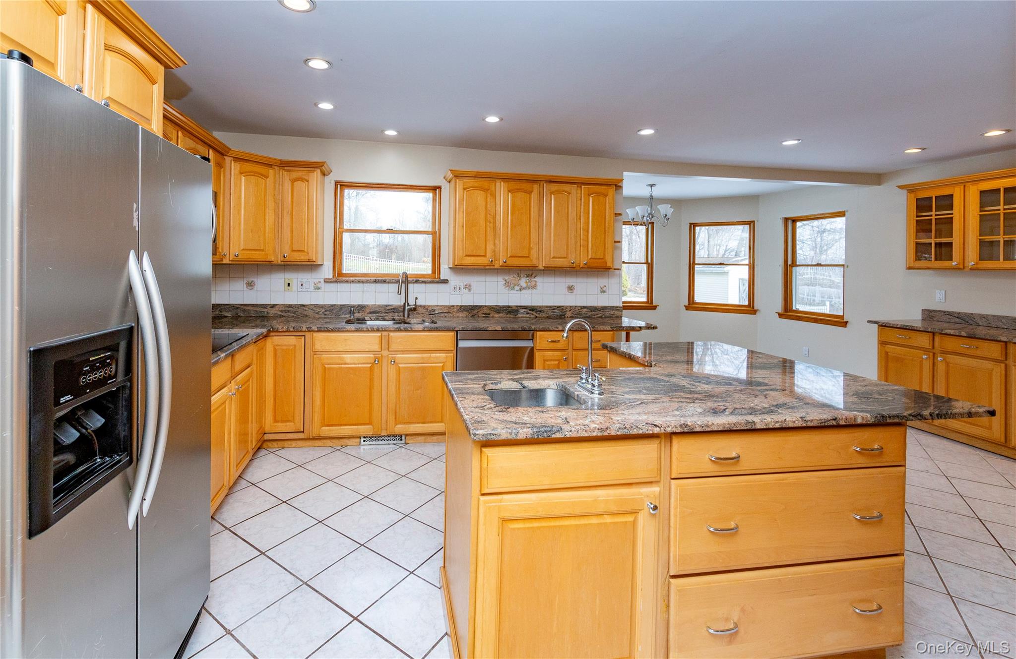 9 Caroline Drive Patterson, NY 12563 - Photo 12 of 50 Center island with prep sink and island seating on the right side.